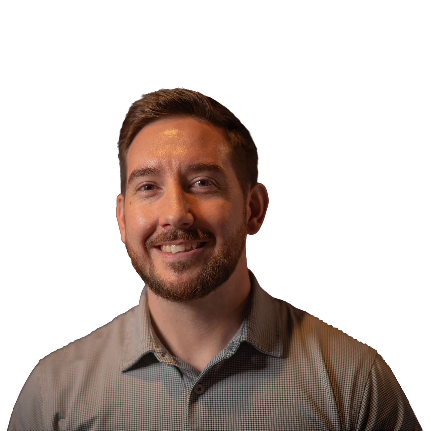 Professional headshot of a smiling man wearing a light gray checkered button-down shirt.