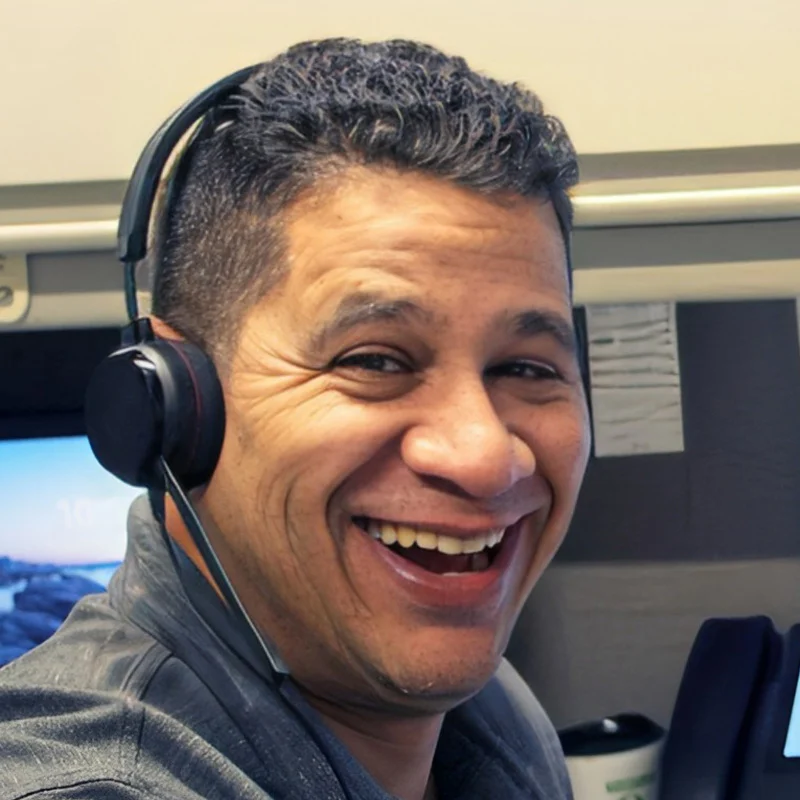 Close up smiling Turtle Company employee with headset and phone