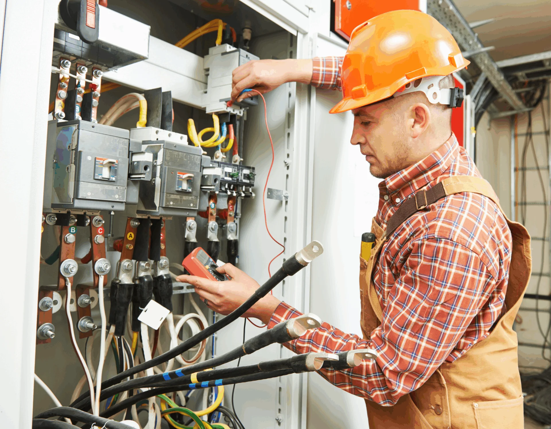 Technician repairing industrial control panel