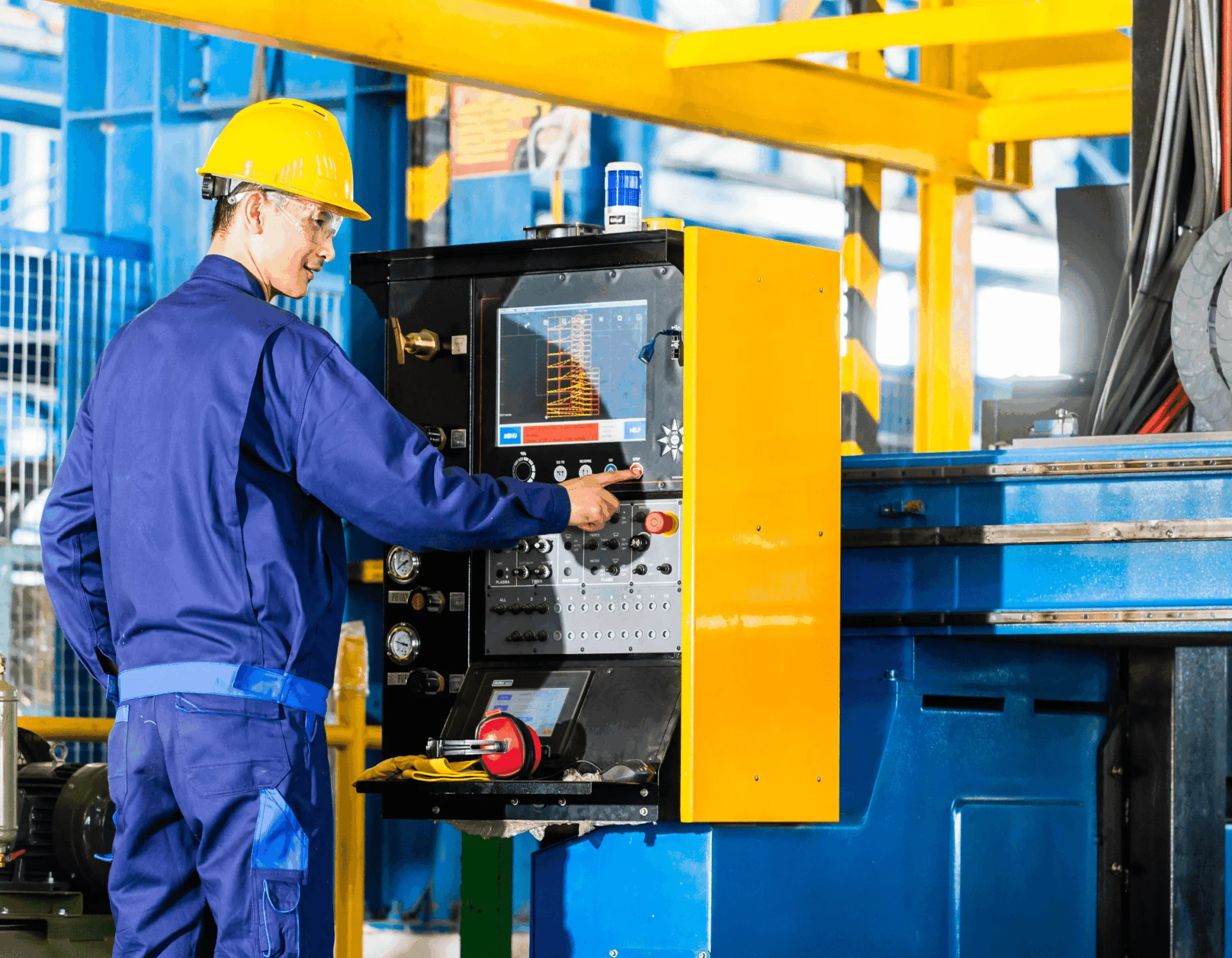 Industrial worker operating factory machinery