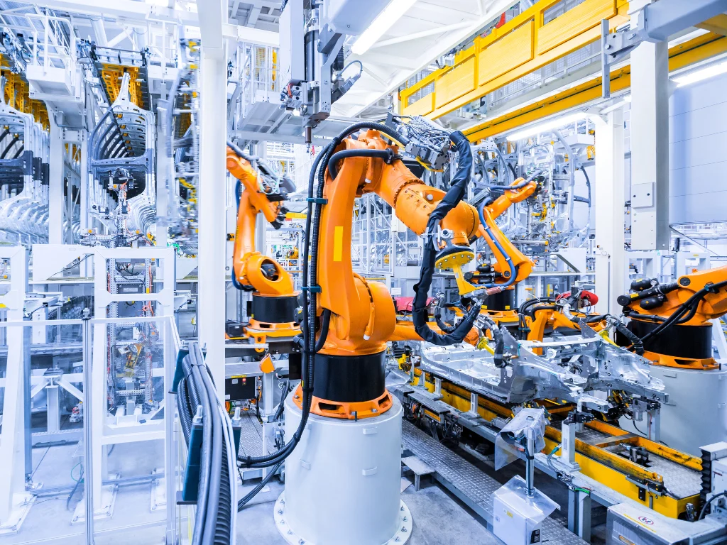Advanced robotics in EV manufacturing assembly line.