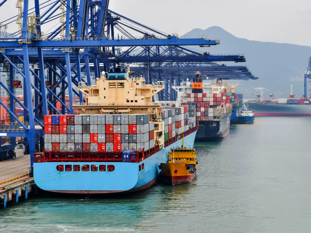 Large shipping container vessel at port terminal