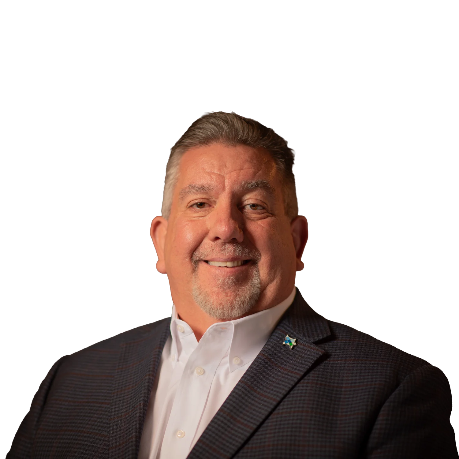 Professional headshot of a smiling man wearing a dark checkered blazer over a light dress shirt.