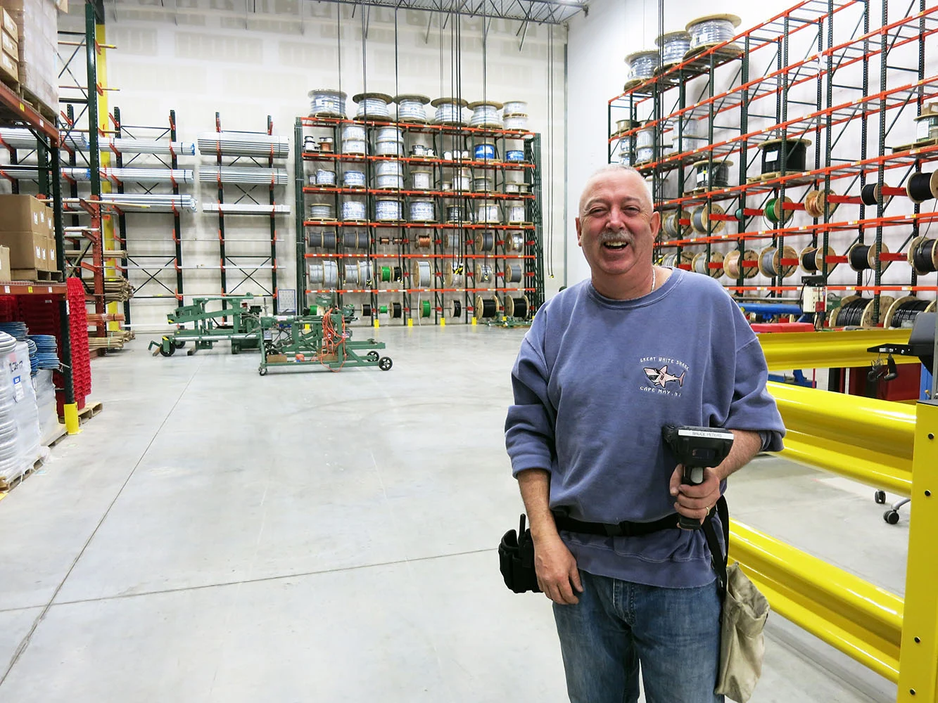 A warehouse employee with work scanner gun.