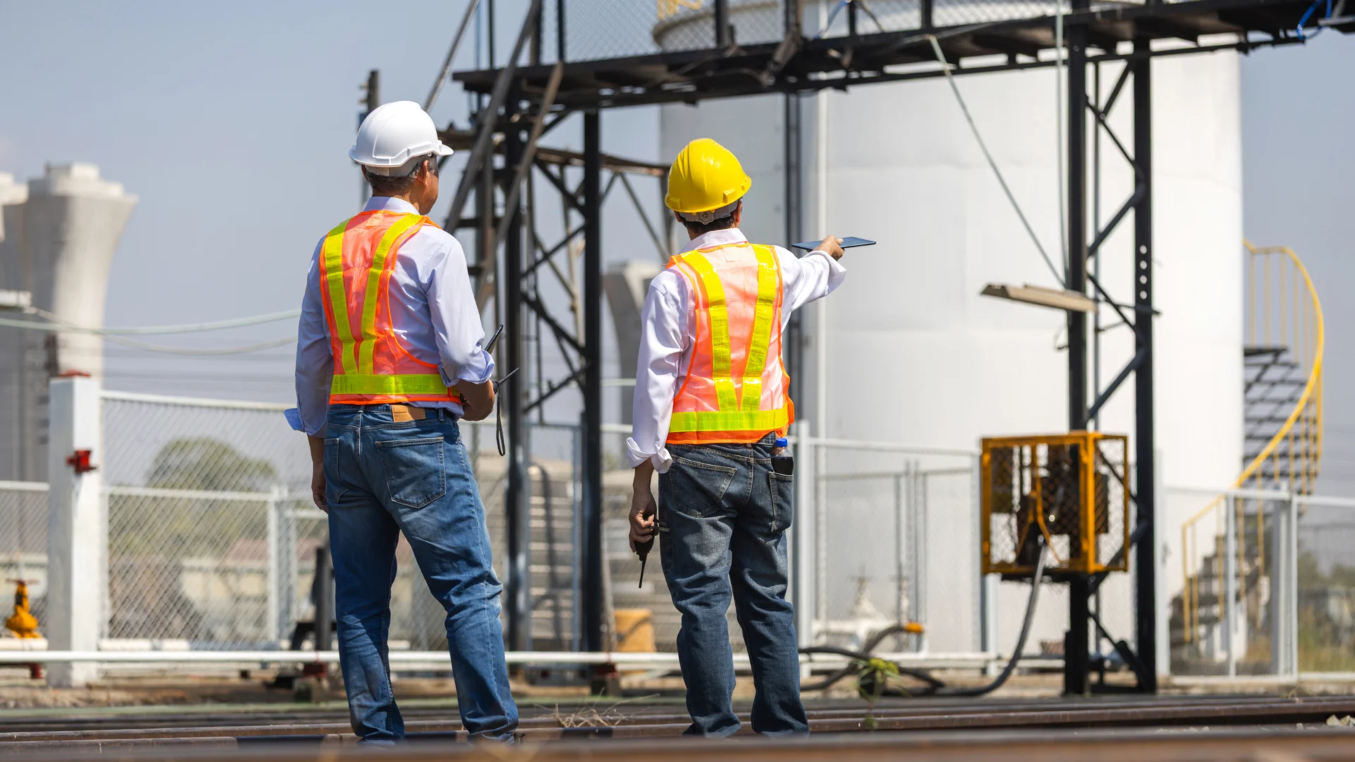 Electrical facility maintenance workers evaluating infrastructure