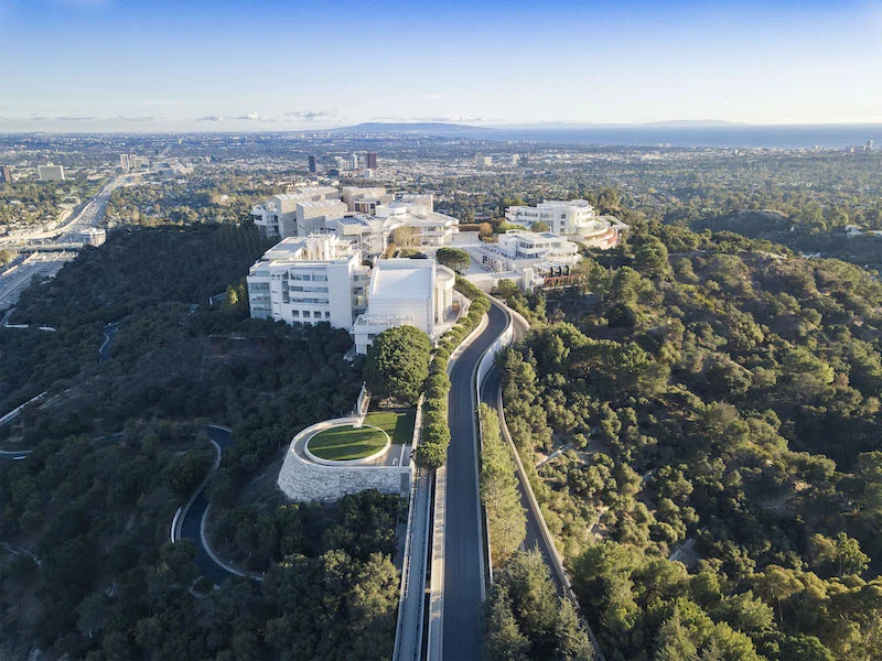 Getty Center museum complex on a hilltop overlooking Los Angeles skyline and surrounding green hills
