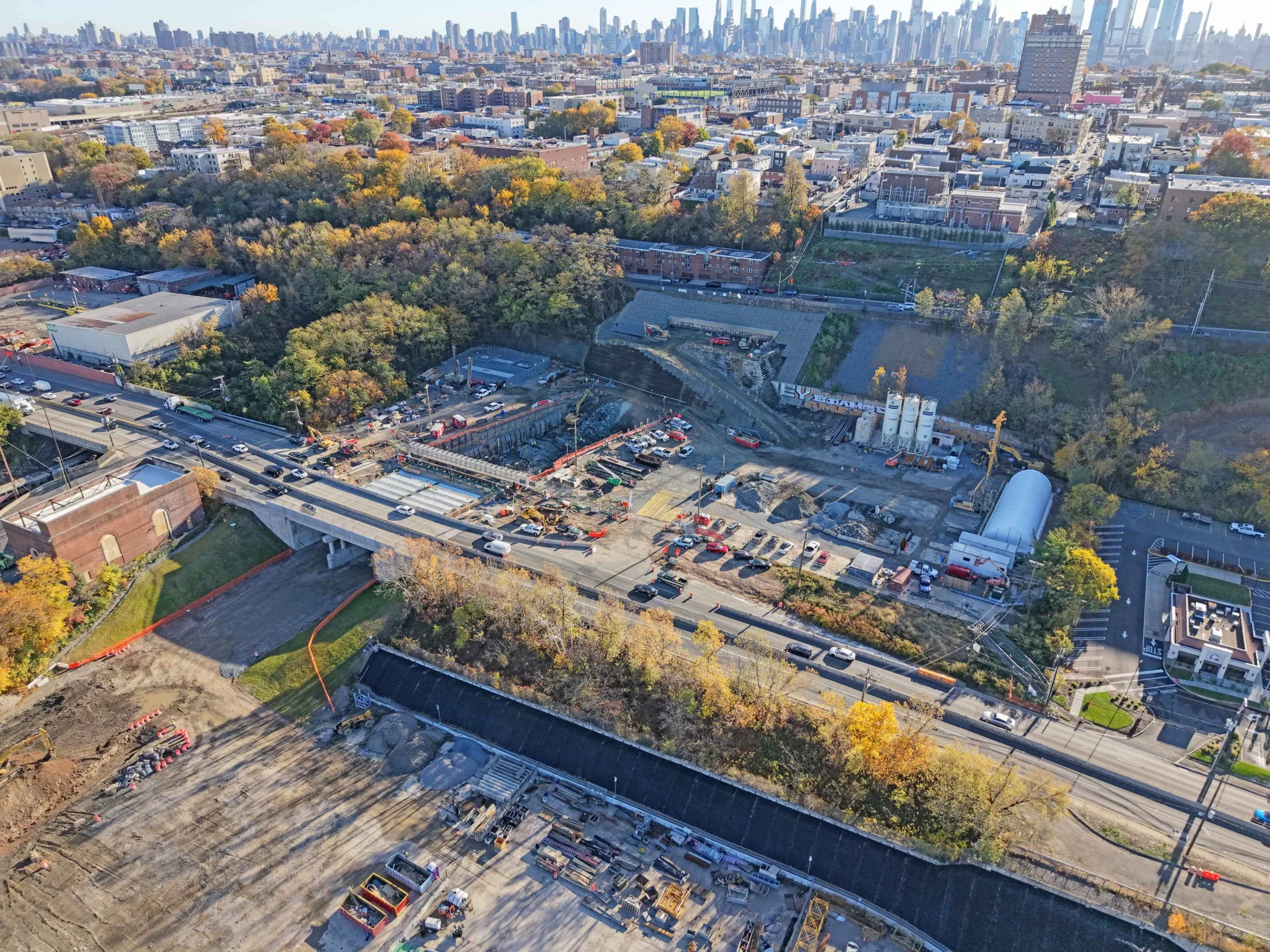 Aerial view of Palisades Tunnel construction in New Jersey with the NYC skyline in the background.